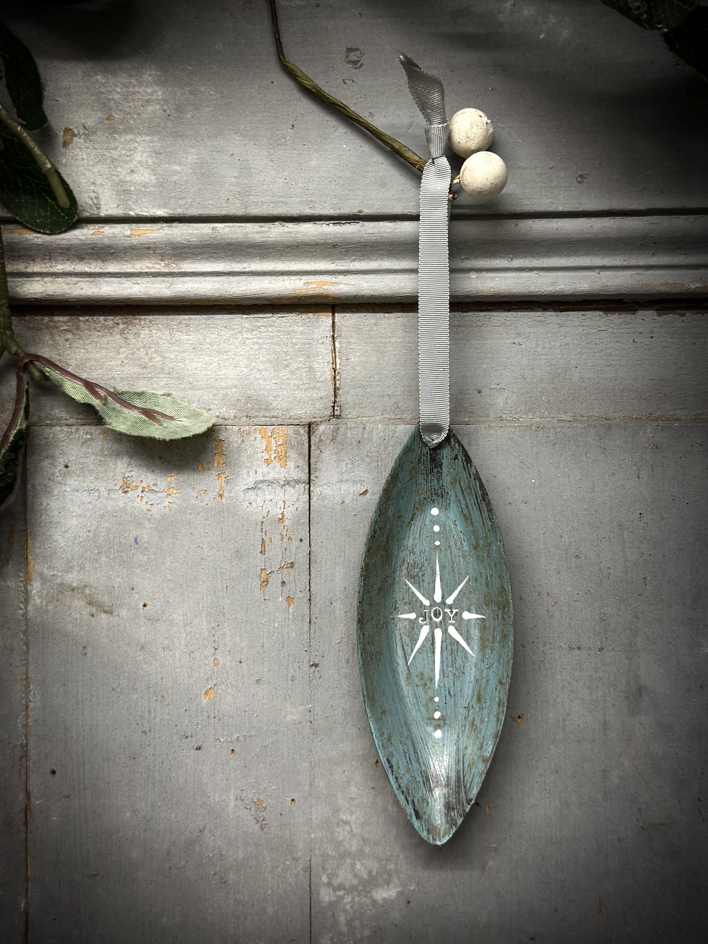 A Reworked French Patisserie Tin Christmas Decoration Stamped and Painted “Joy”