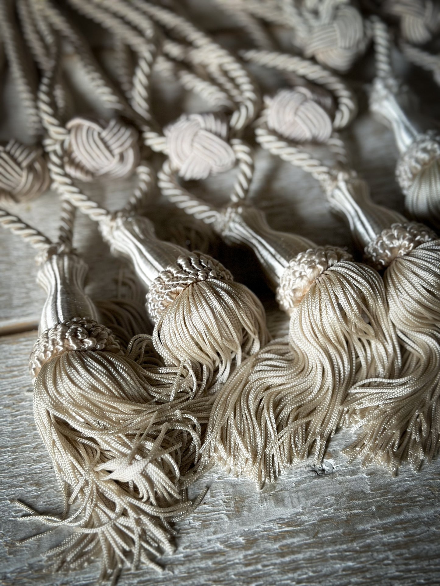 A pair of pretty vintage ivory curtain tie backs