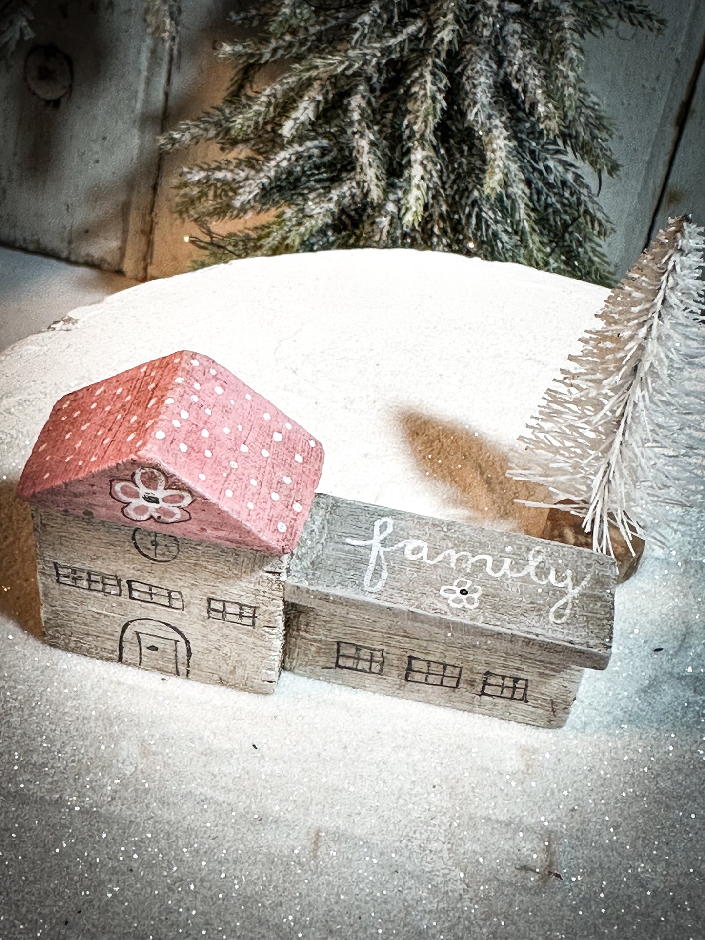 A pretty vintage German Erzgebirge Putz wooden village house painted with a Christmas quote