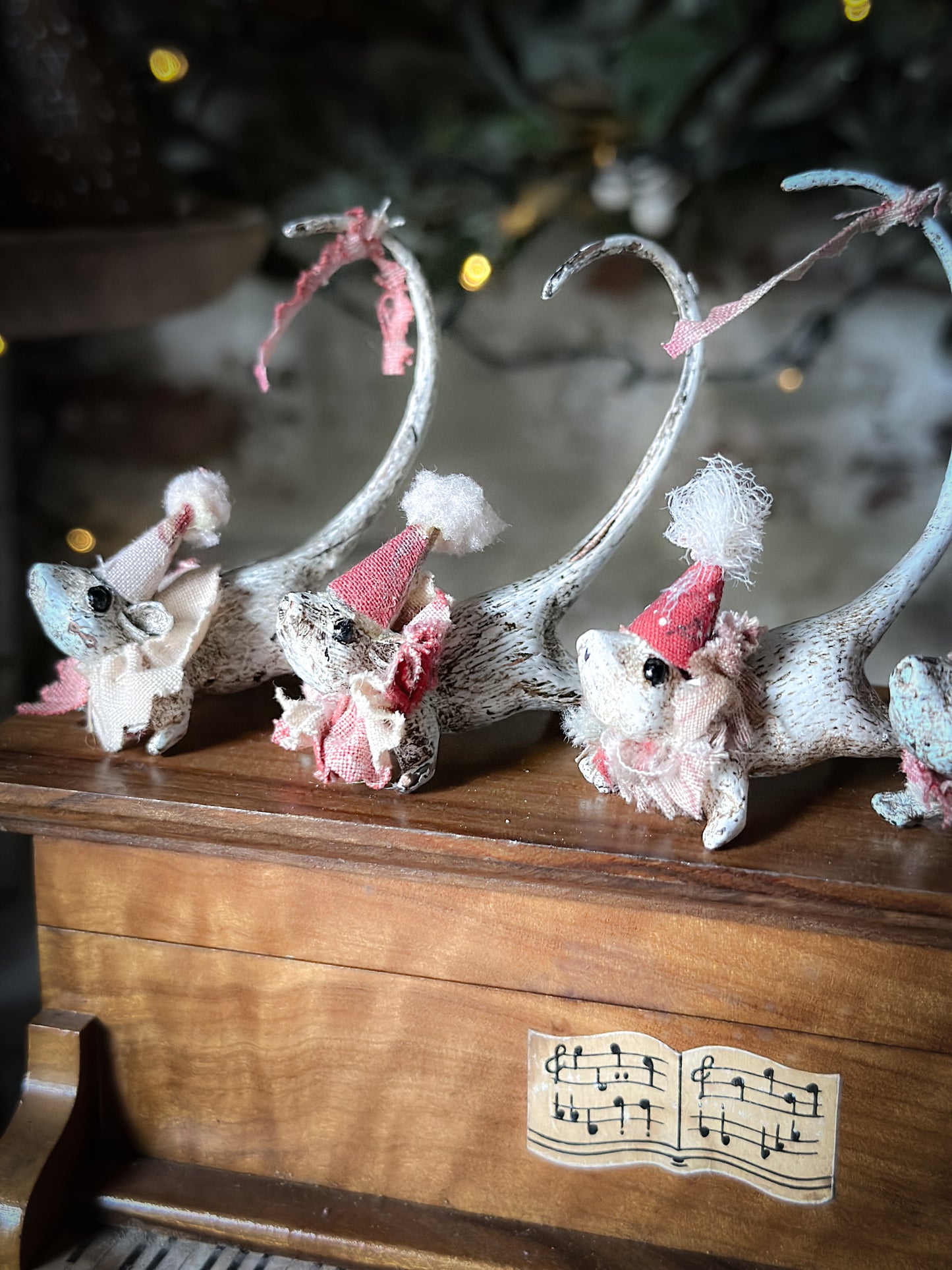 A cold painted brass “night before Christmas mouse” with a fabric ruffle and Christmas hat