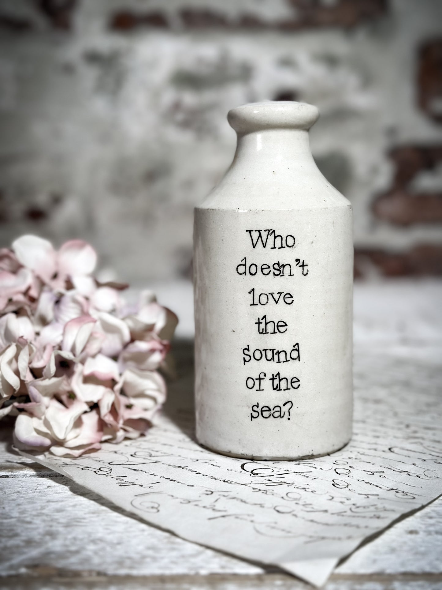 An Antique Pottery Bottle with a Hand Painted Inspirational Quote