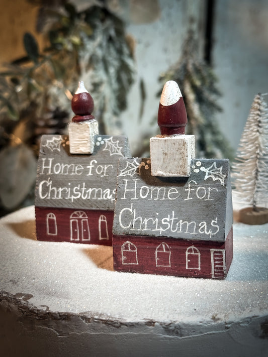 A pretty vintage German Erzgebirge Putz wooden village house painted with a Christmas quote