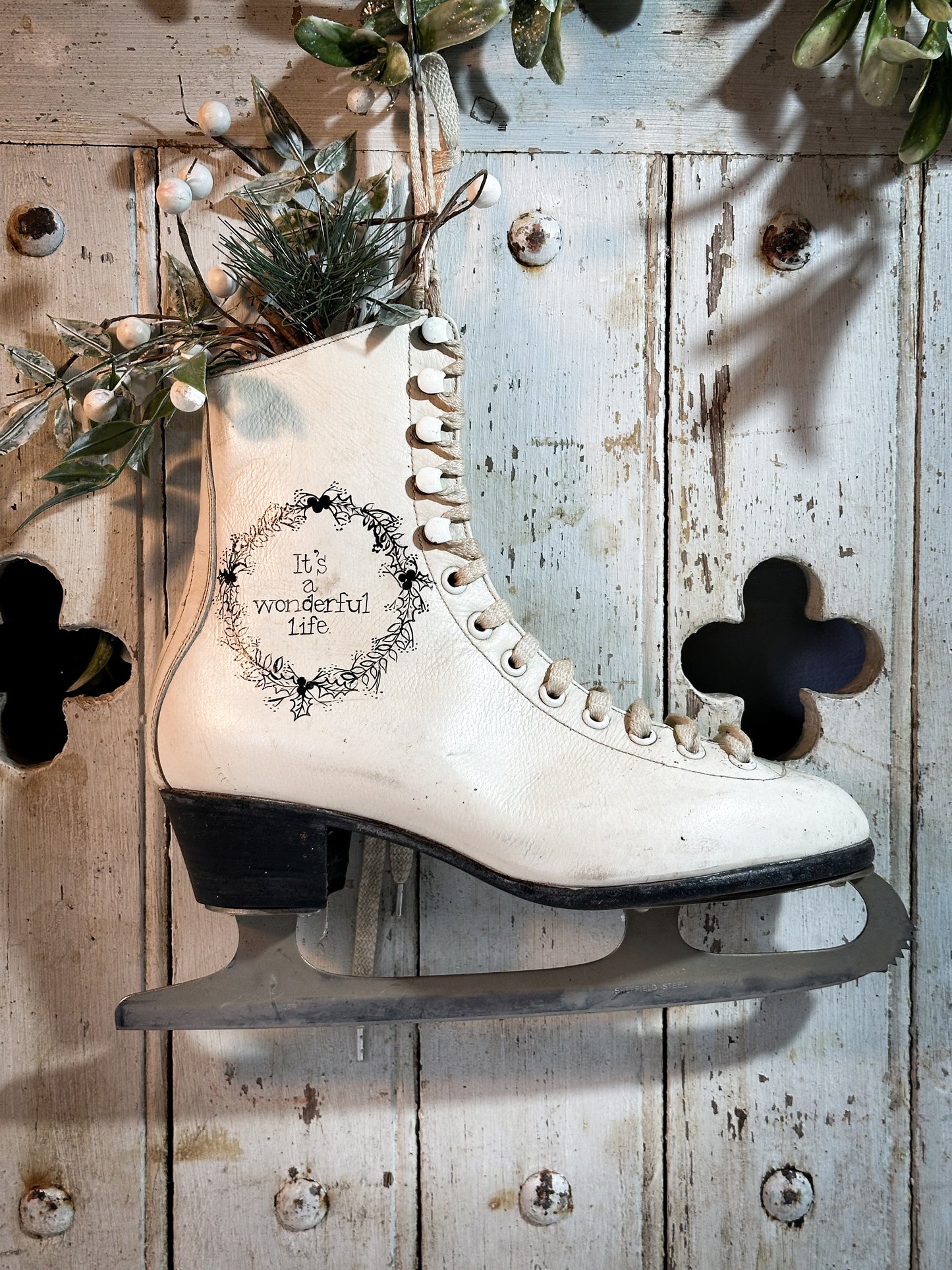 A beautiful vintage Christmas ice skate hand painted using traditional sign writer’s techniques and materials