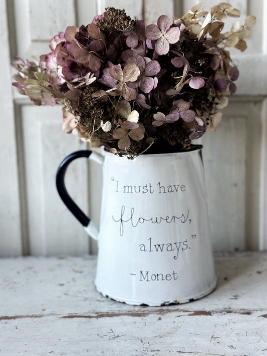 A hand painted quote on a beautiful Vintage white enamelware jug