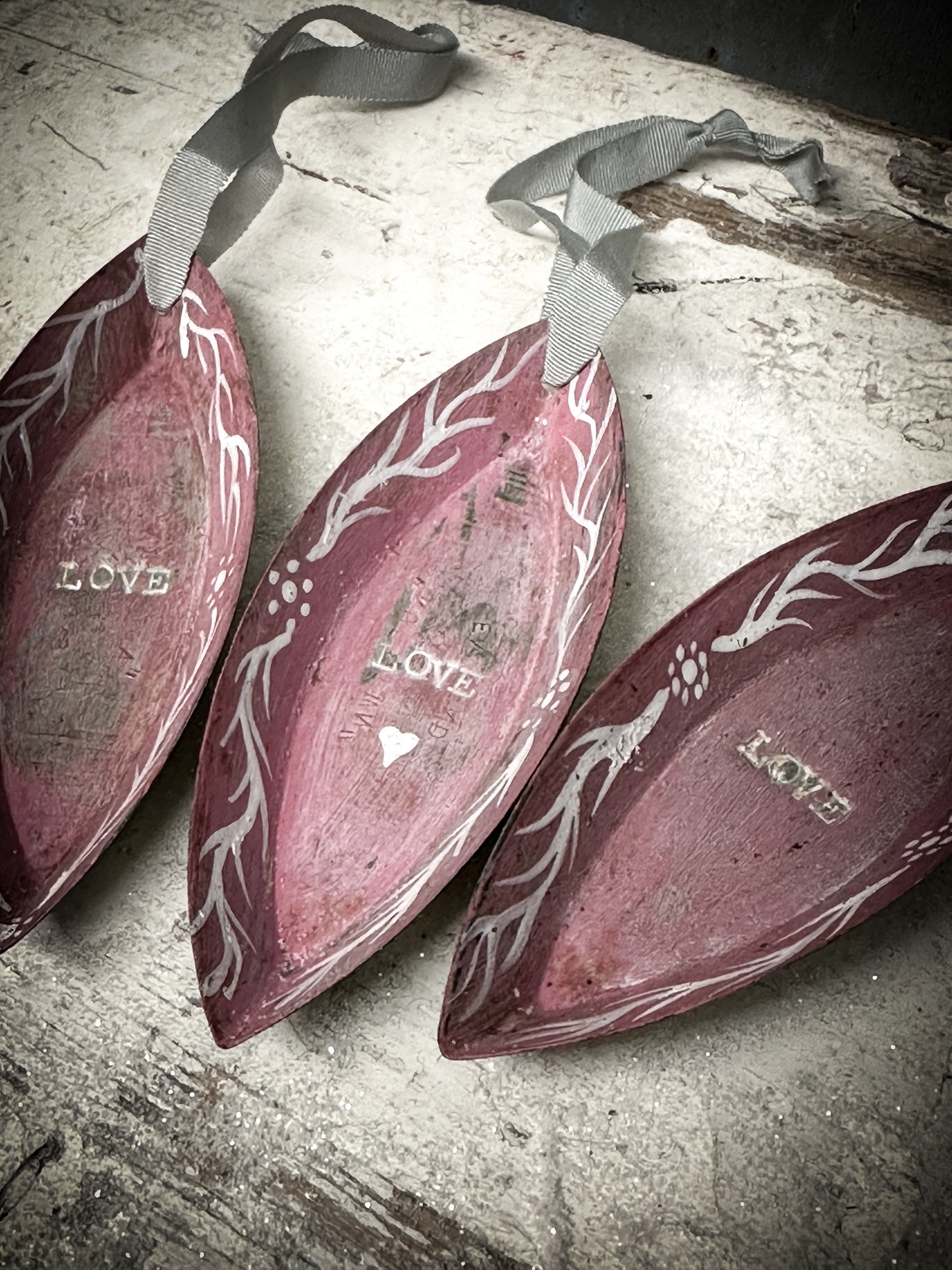 A Reworked French Patisserie Tin Christmas Decoration Stamped and Painted “love”