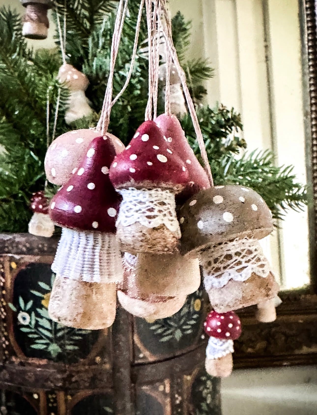 A wooden hand painted and trimmed Hanging Christmas tree toadstool
