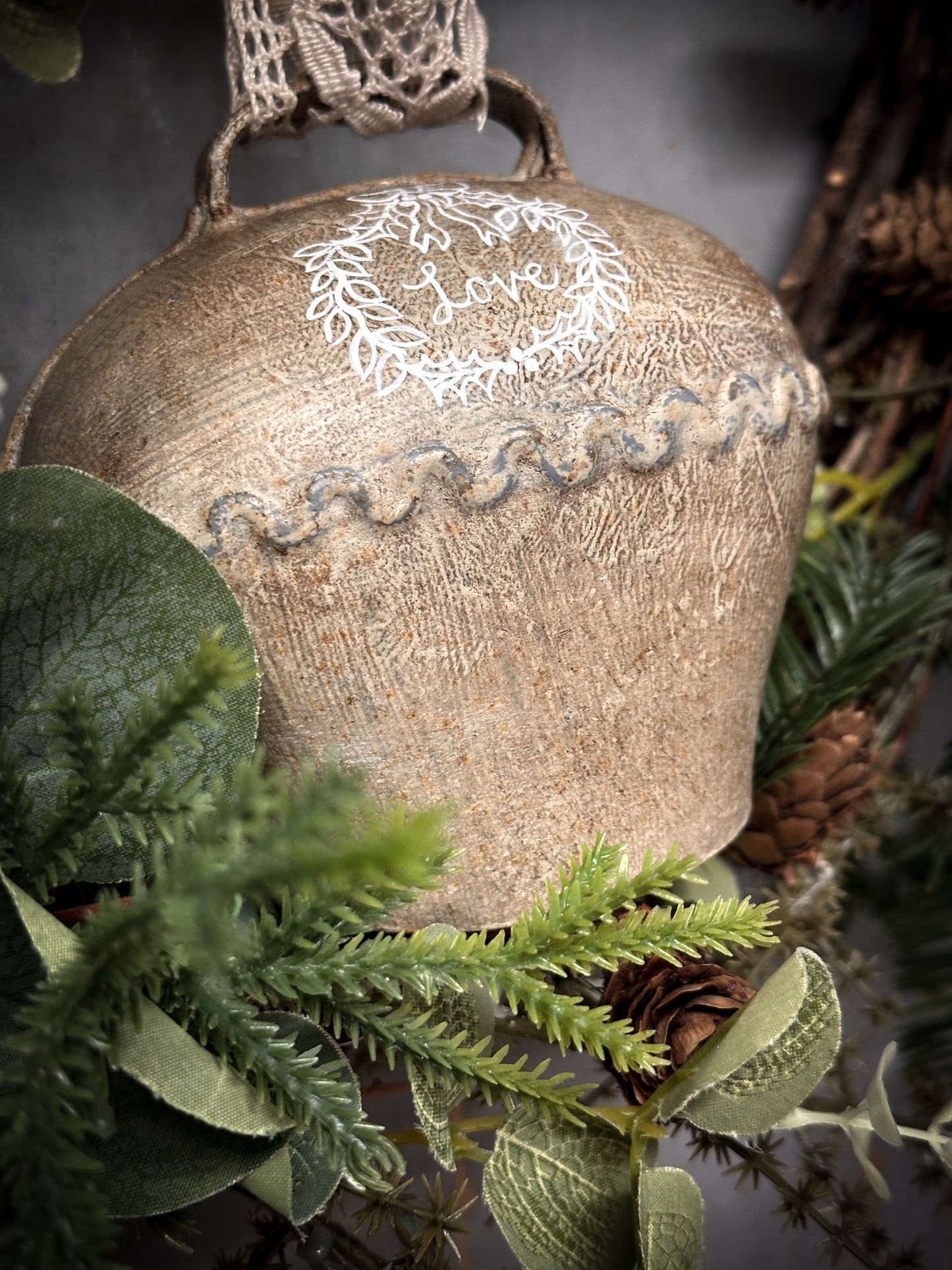 A Large Vintage Painted Cow Bell With a Hand Painted Quote