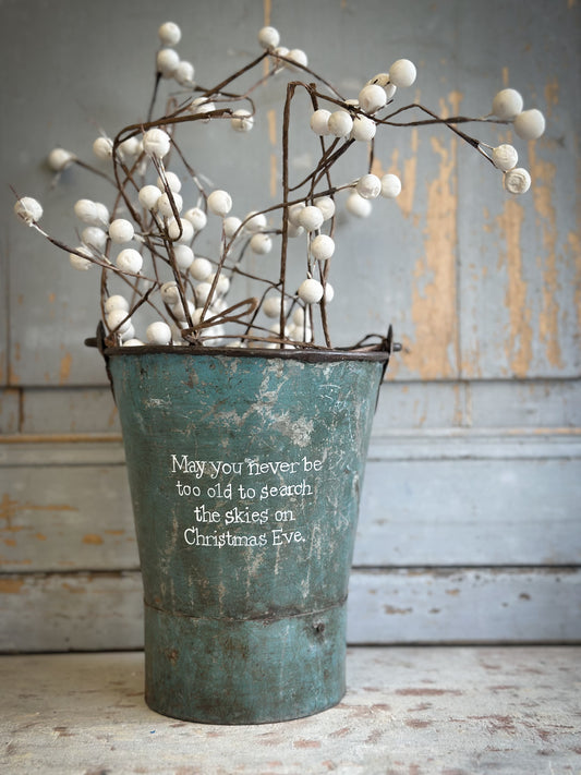 A Recycled Metal Mini Christmas Tree Bucket With A Hand Painted Quote