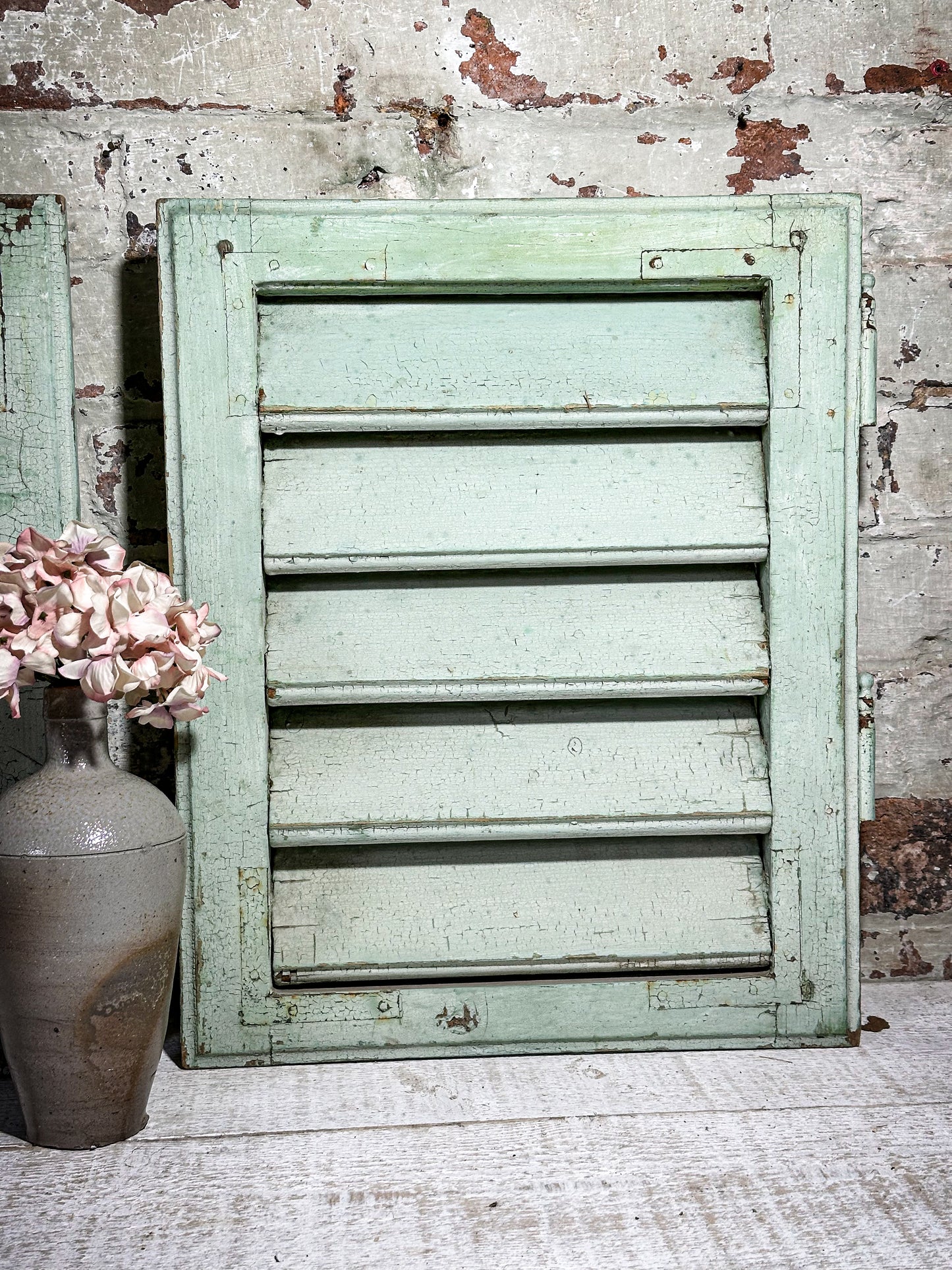 A Pair of French Green Chippy Painted Shutters