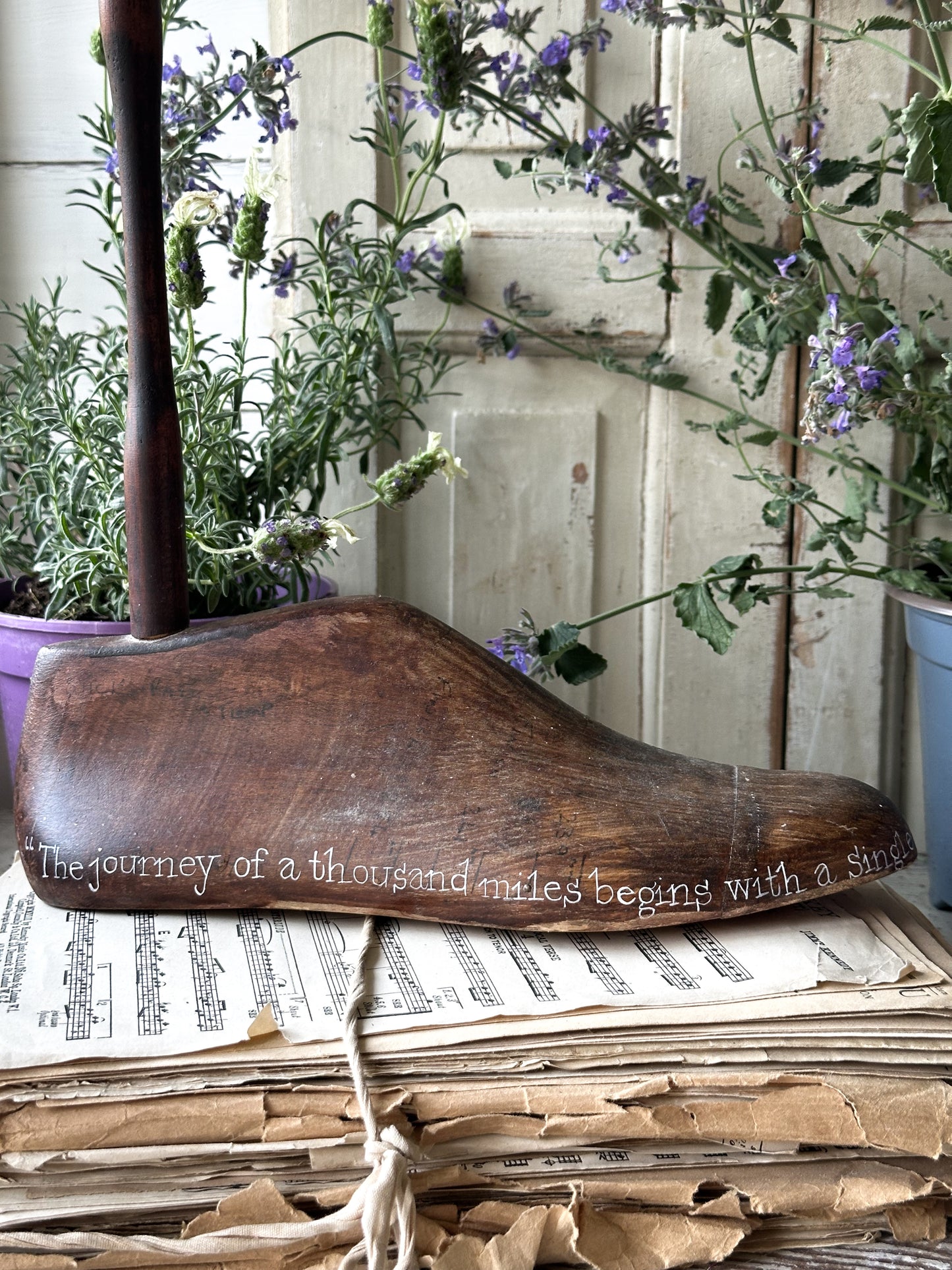 An antique wooden painted adult’s shoe last.