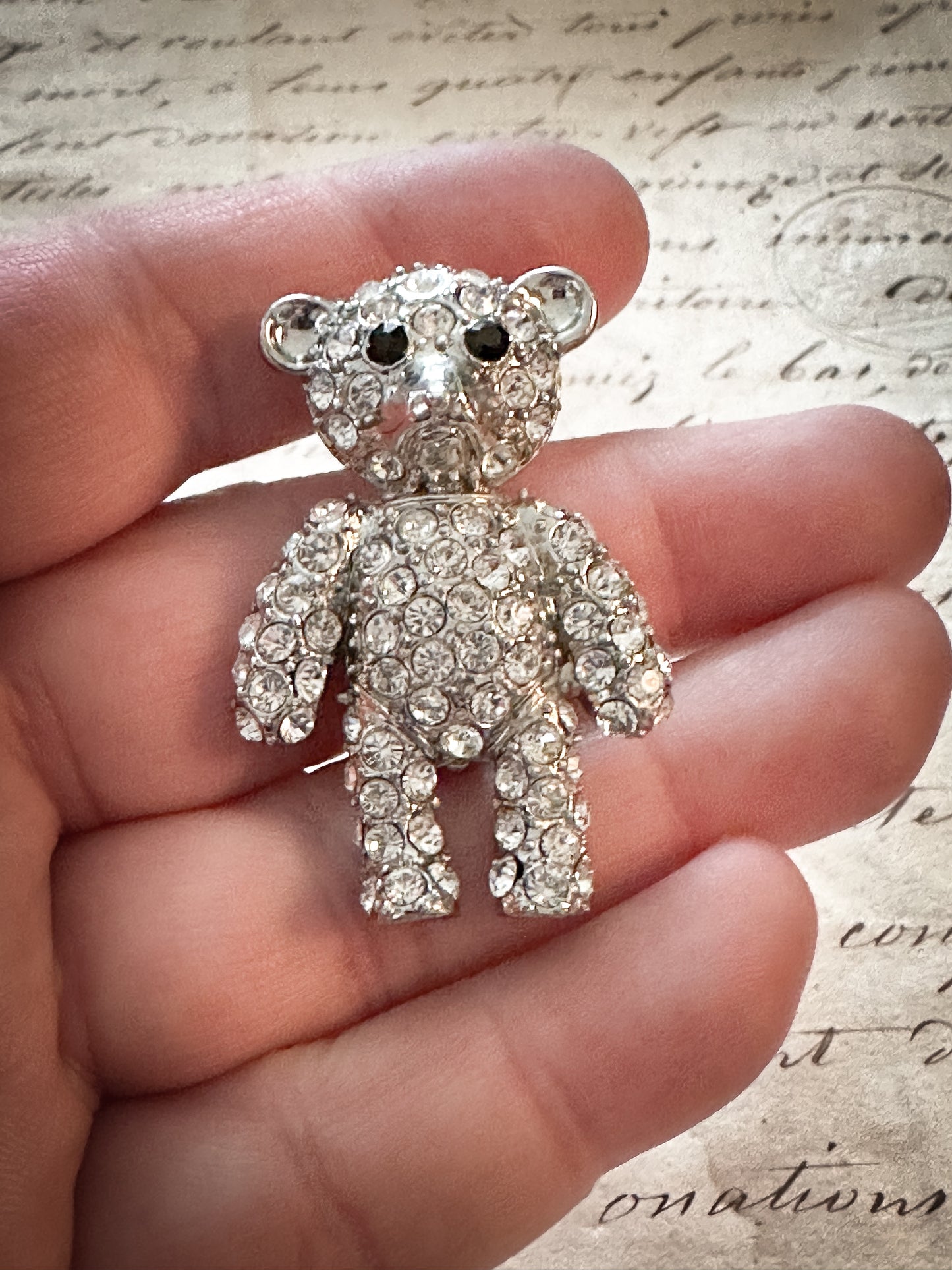 A sweet vintage diamanté teddy bear brooch