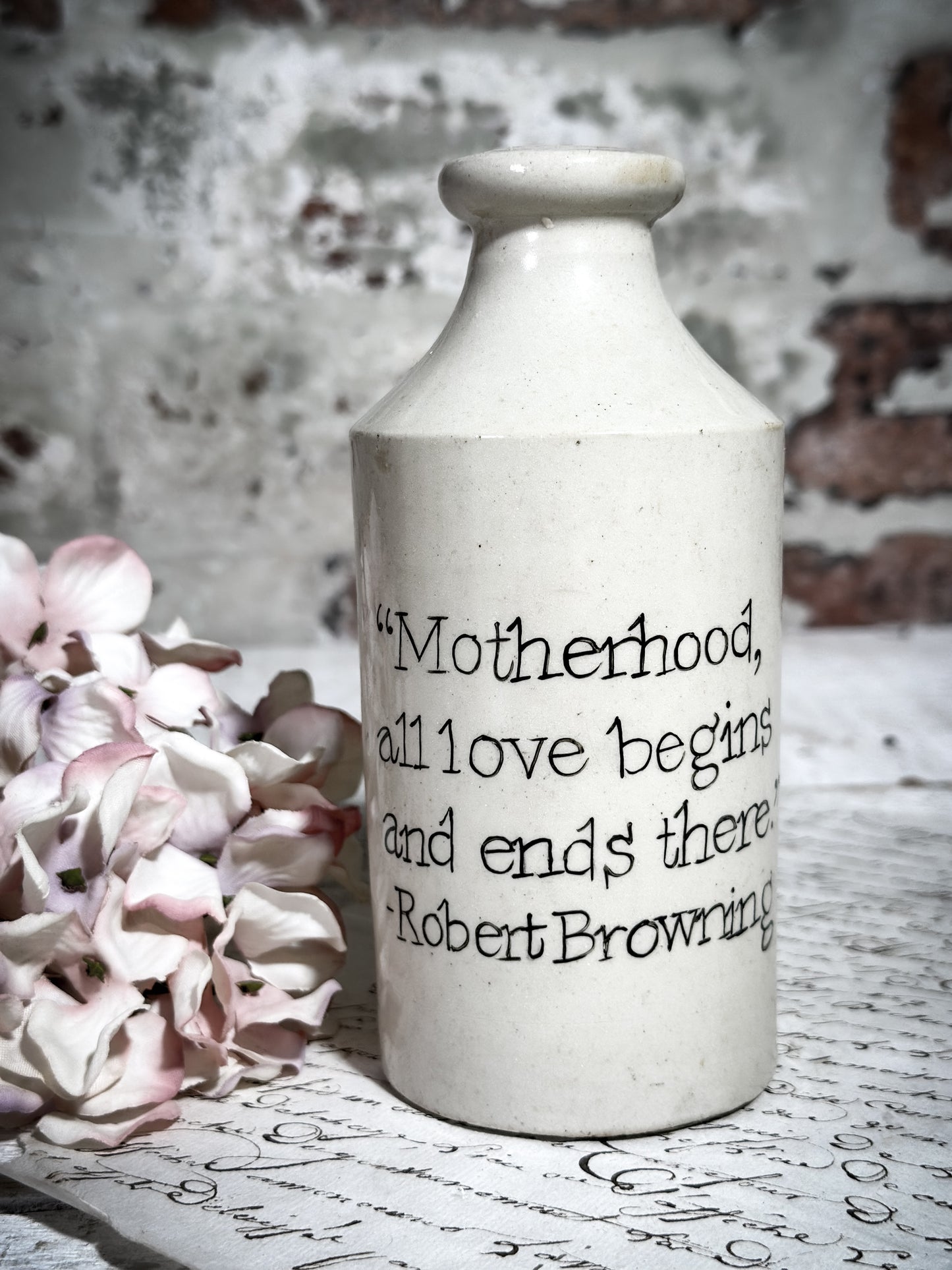 An Antique Pottery Bottle with a Hand Painted Inspirational Quote