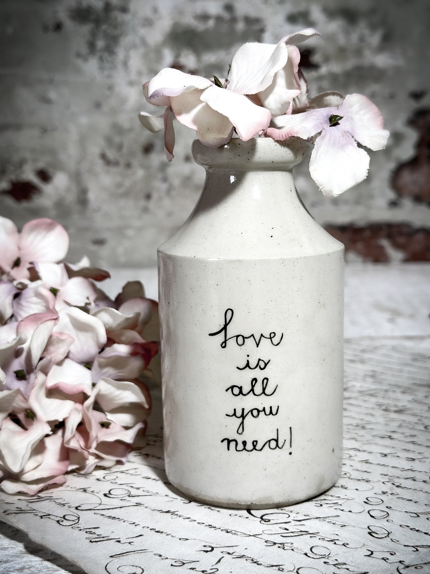 An Antique Bottle with a Hand Painted Inspirational Quote