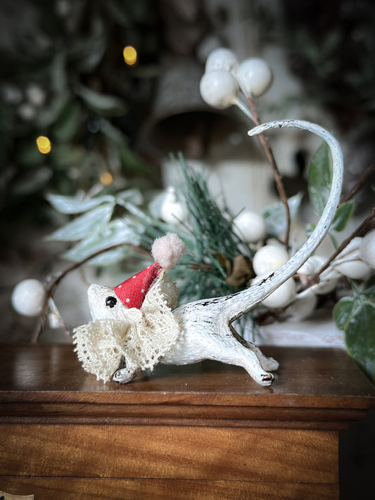 A cold painted brass “night before Christmas mouse” with a lace ruffle and Christmas hat