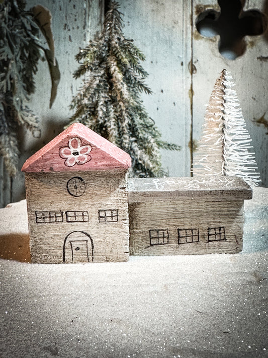 A pretty vintage German Erzgebirge Putz wooden village house painted with a Christmas quote