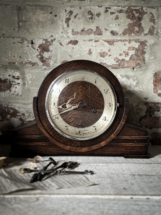 A 1930’s Mantle clock with glass cover and original key