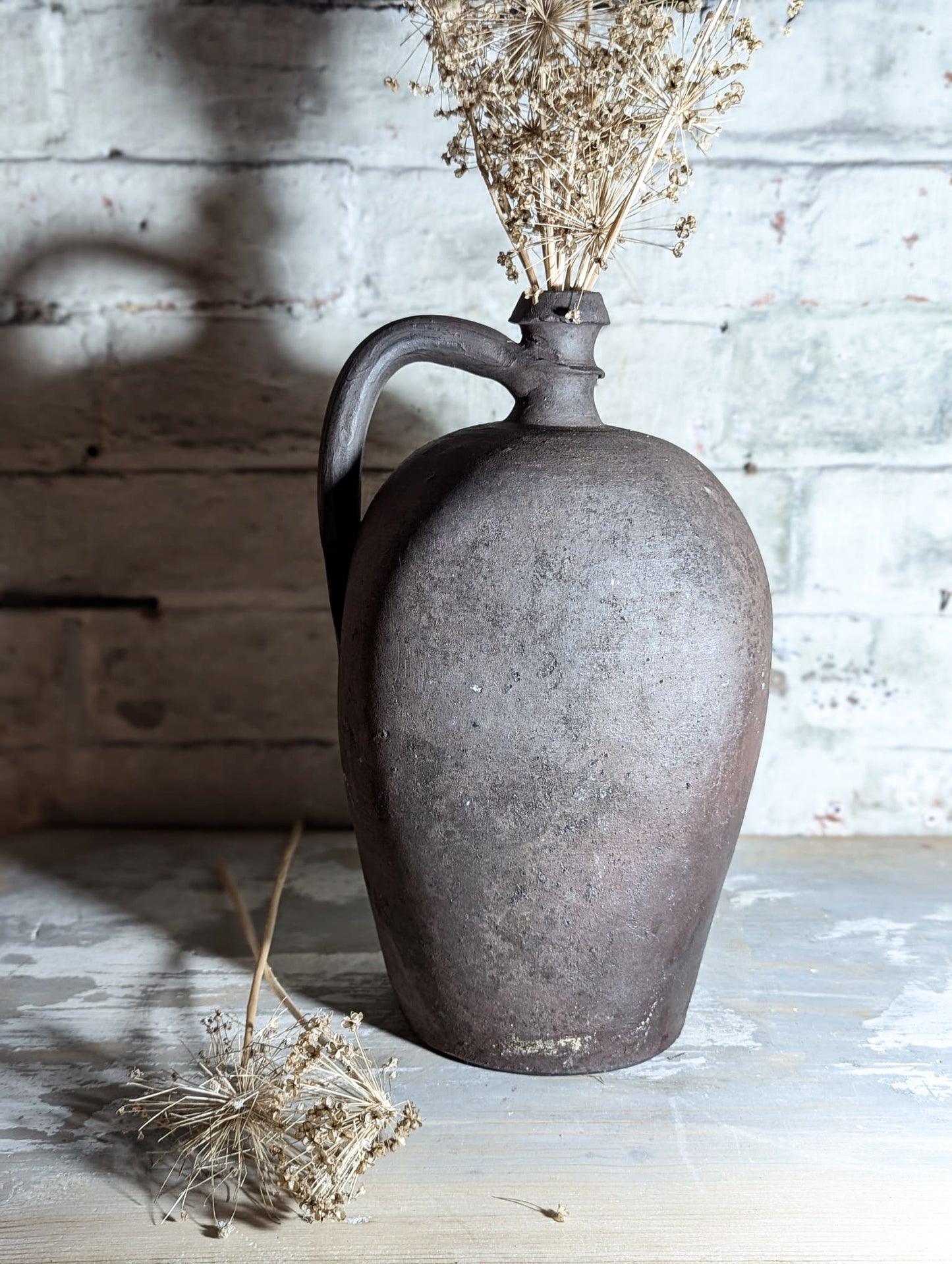 A stunning large Primitive French Antique Black Pottery oil bottle