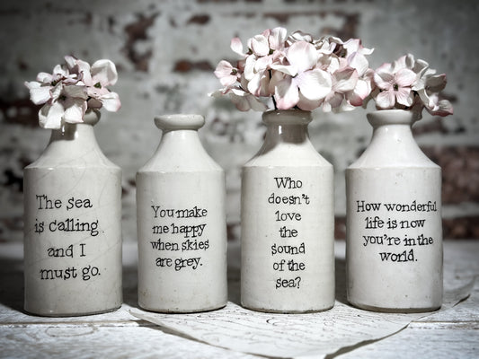 An Antique Pottery Bottle with a Hand Painted Inspirational Quote