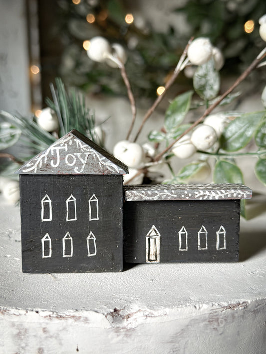 A pretty vintage German Erzgebirge Putz wooden village house painted with a Christmas quote