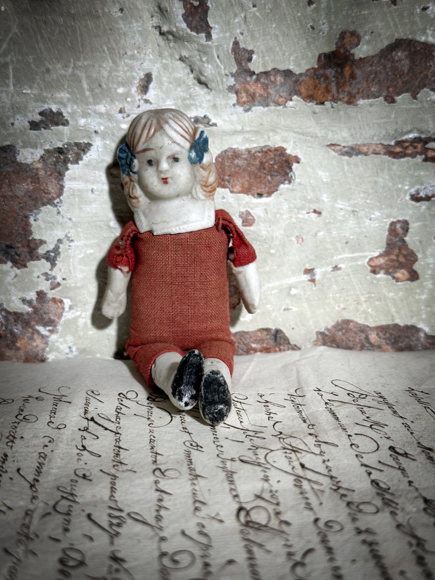 A vintage bisque head and shoulder doll