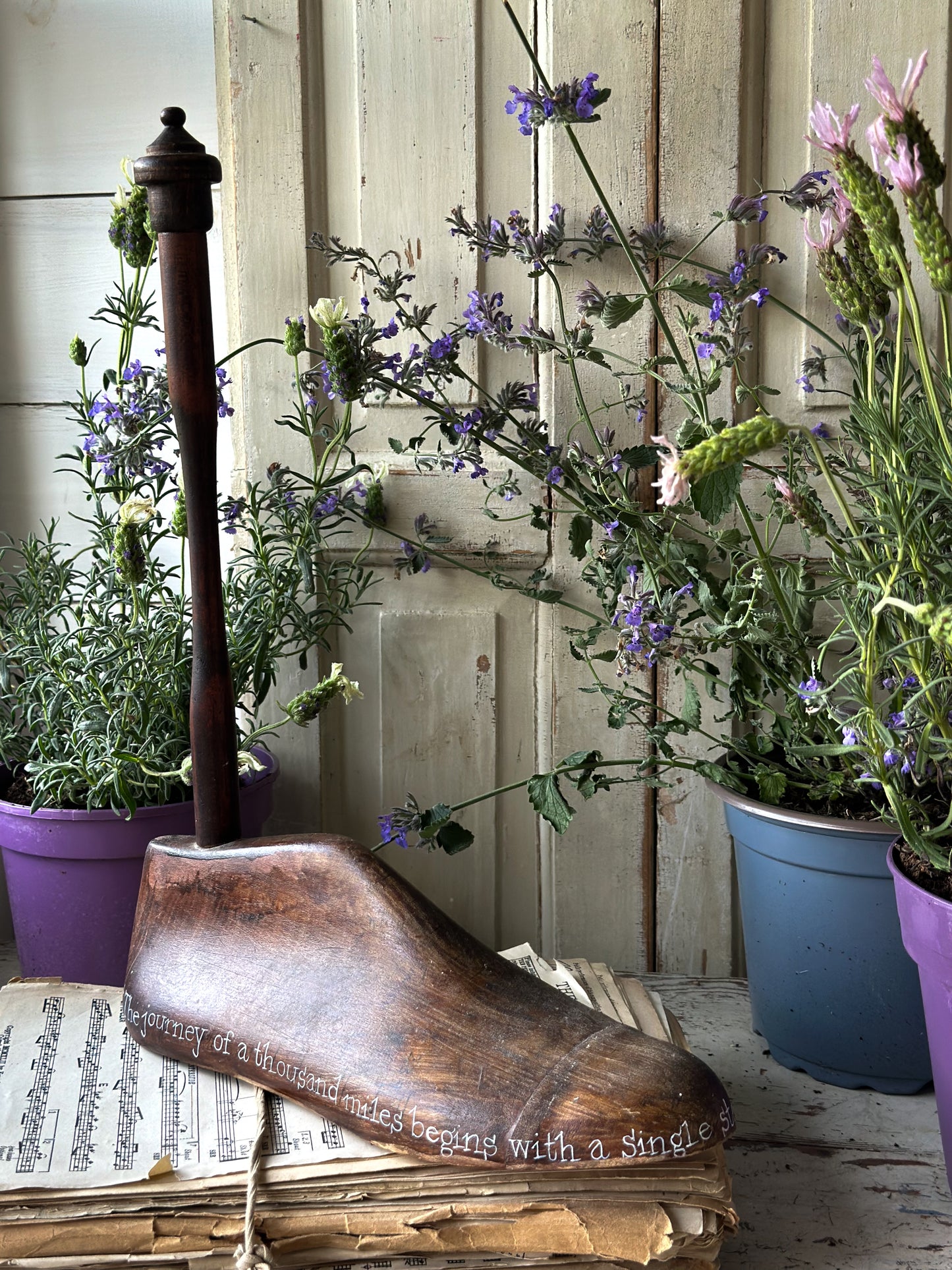 An antique wooden painted adult’s shoe last.