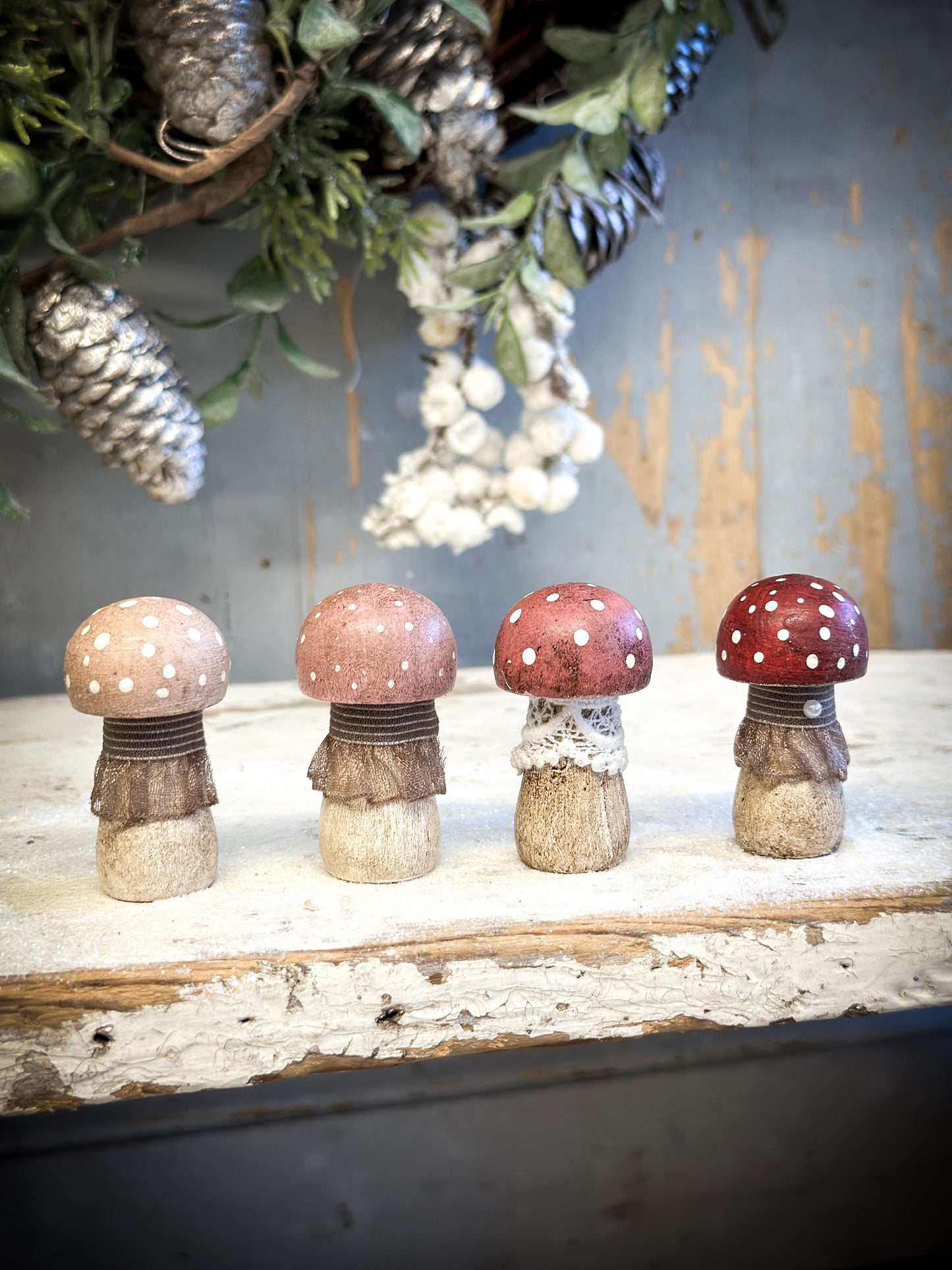 A wooden hand painted and trimmed Christmas village toadstool medium button one