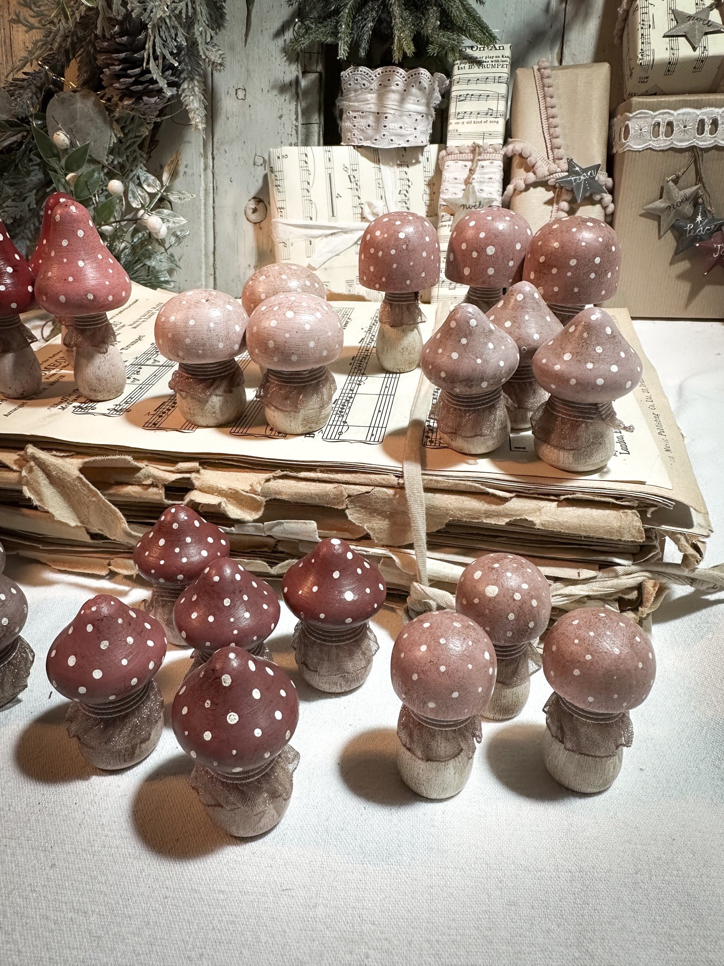 A wooden hand painted and trimmed Christmas village toadstool