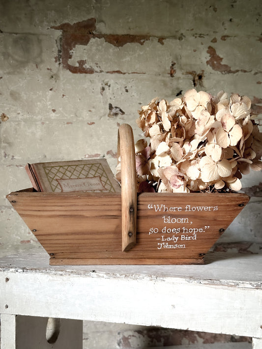 A pretty vintage wooden French garden trug with a hand painted quote