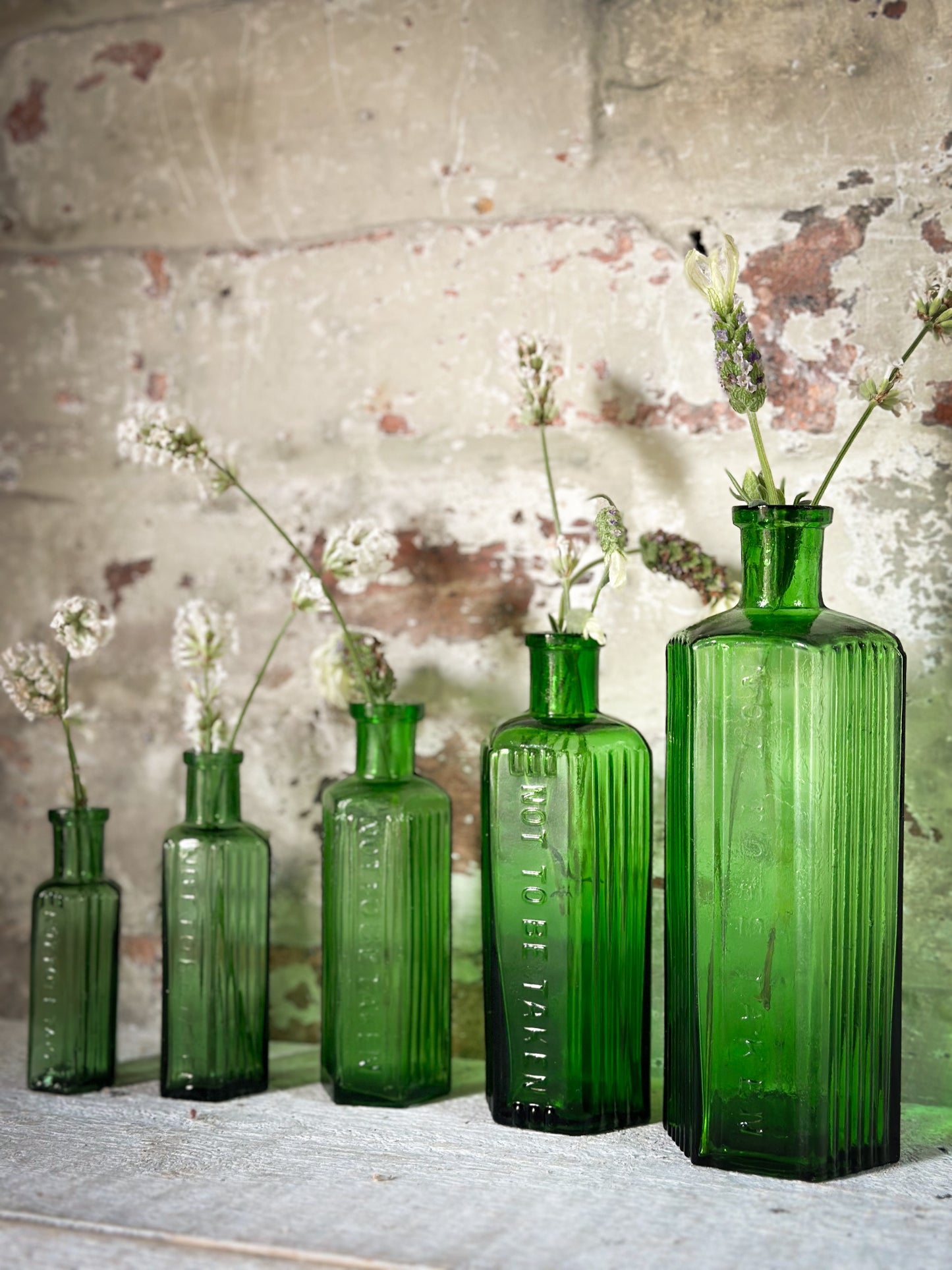 A set of Five lovely antique green poison bottles