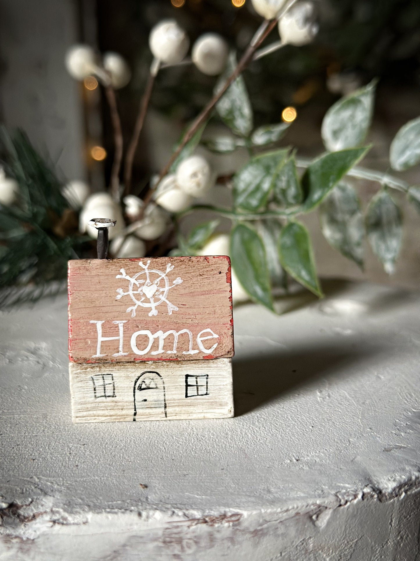 A pretty vintage German Erzgebirge Putz wooden village house painted with a Christmas quote