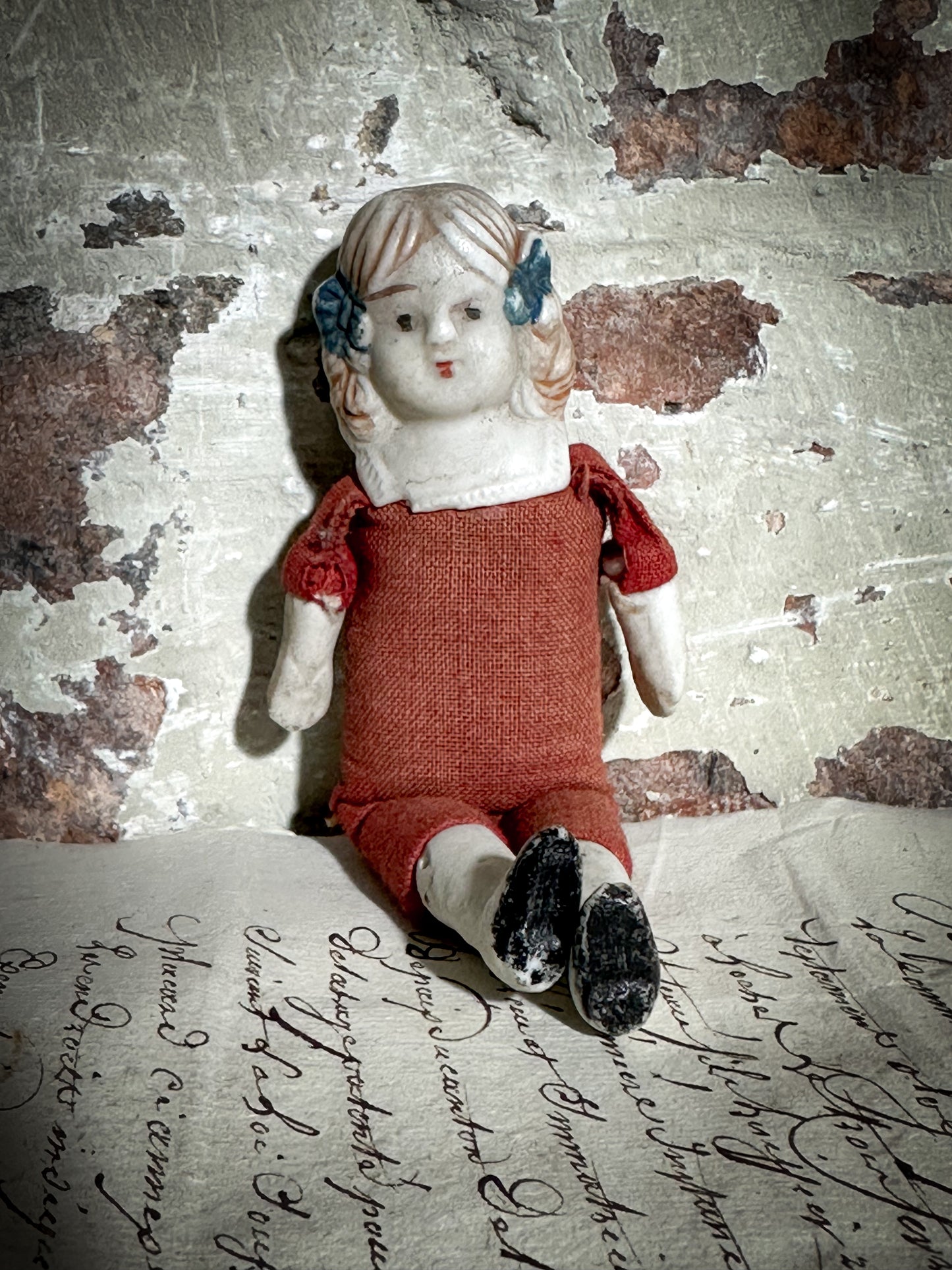 A vintage bisque head and shoulder doll