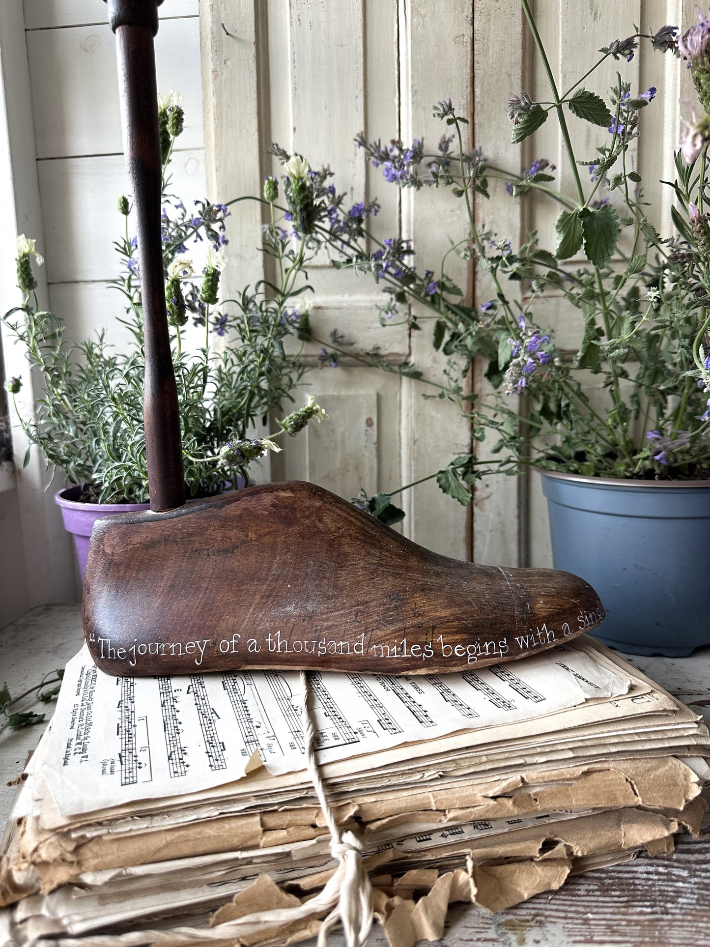 An antique wooden painted adult’s shoe last.