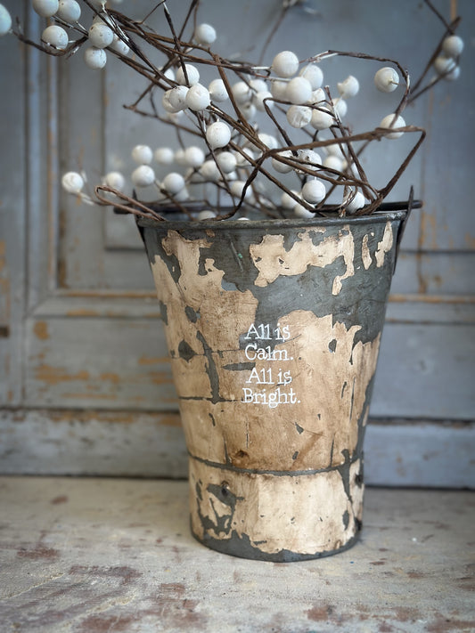 A Recycled Metal Mini Christmas Tree Bucket With A Hand Painted Quote