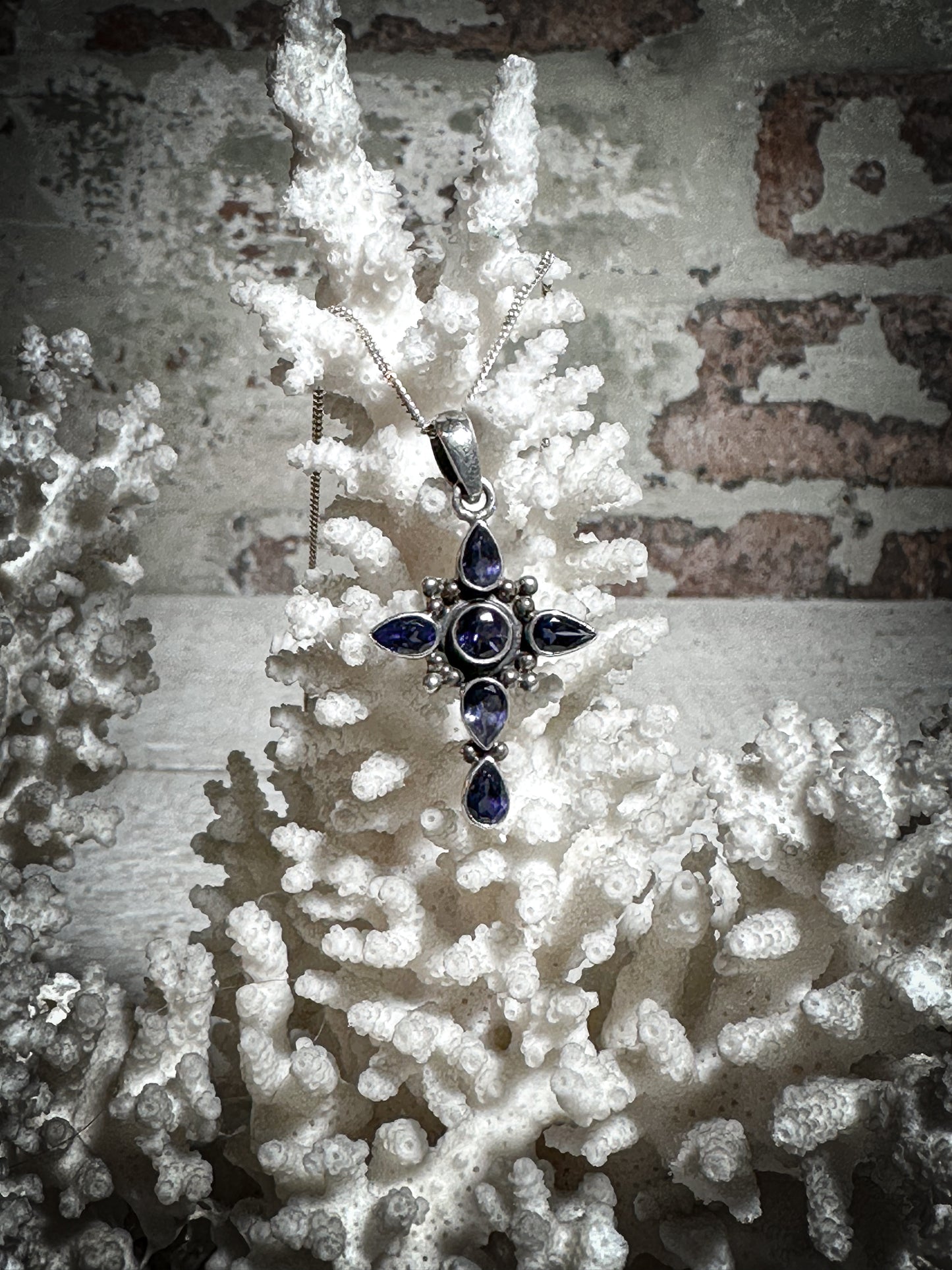 A vintage silver and Tanzanite crucifix