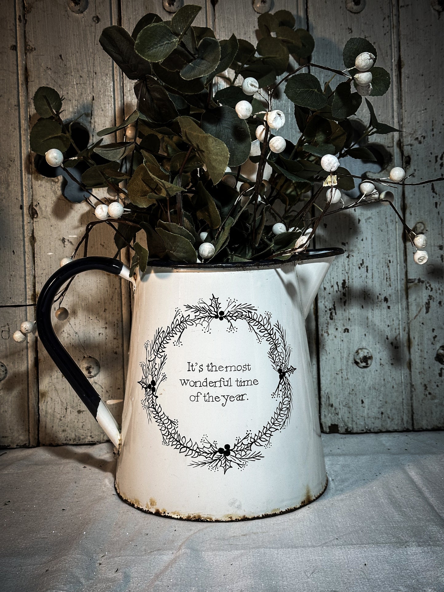 A hand painted quote on a beautiful Vintage white enamelware jug