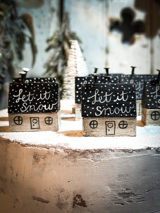 A pretty vintage German Erzgebirge Putz wooden village house painted with a Christmas quote