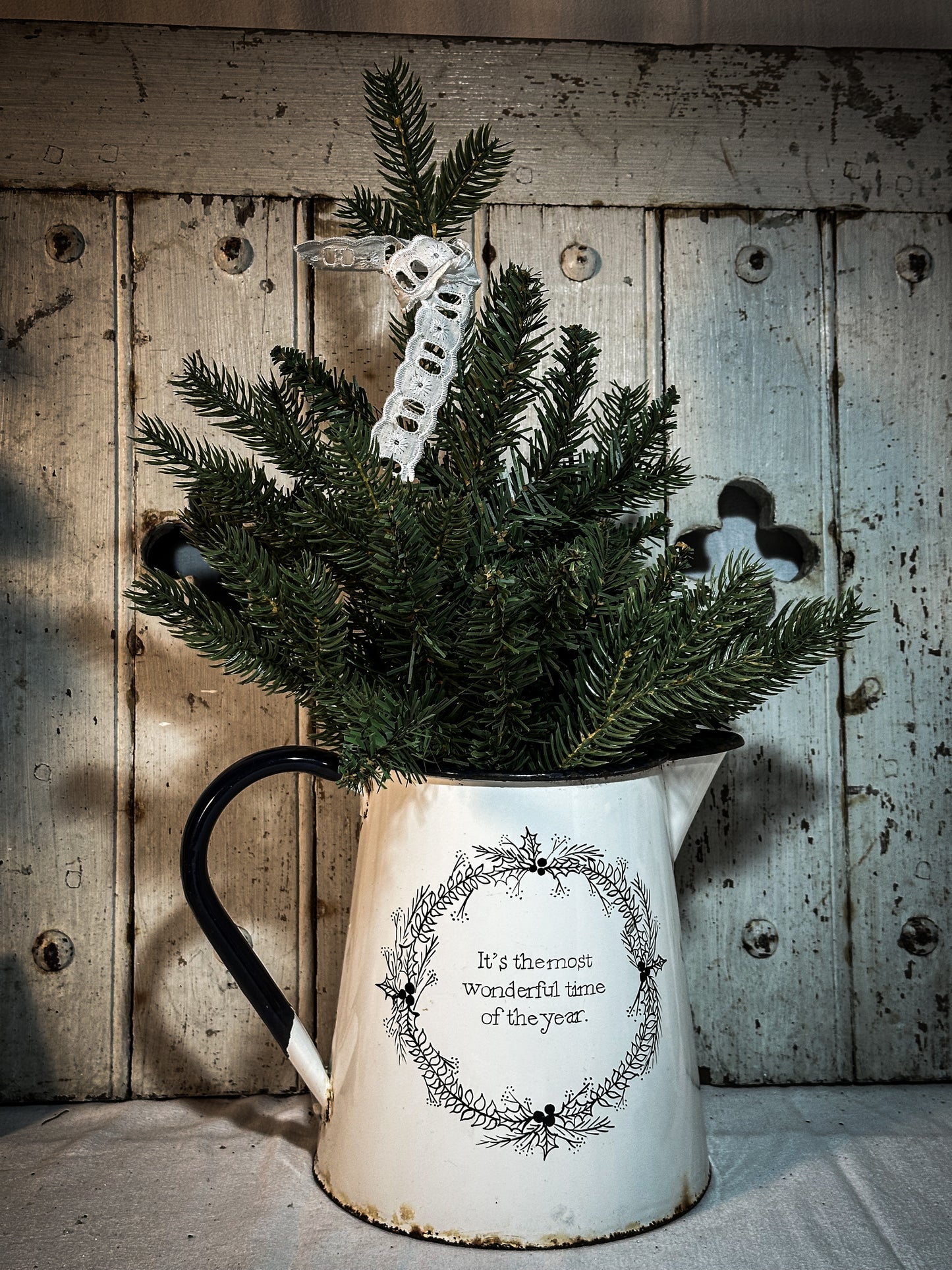 A hand painted quote on a beautiful Vintage white enamelware jug