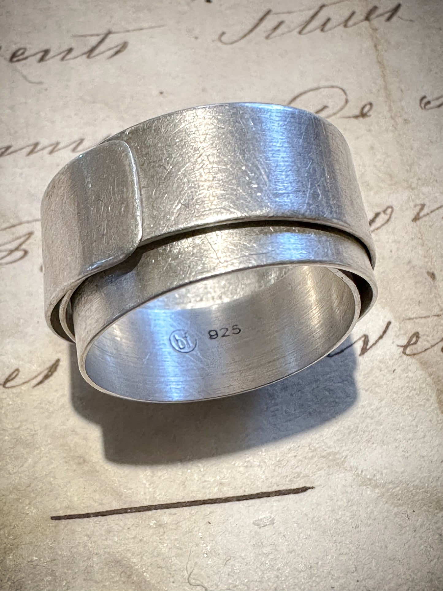 Striking brushed silver modernist wrap cuff ring