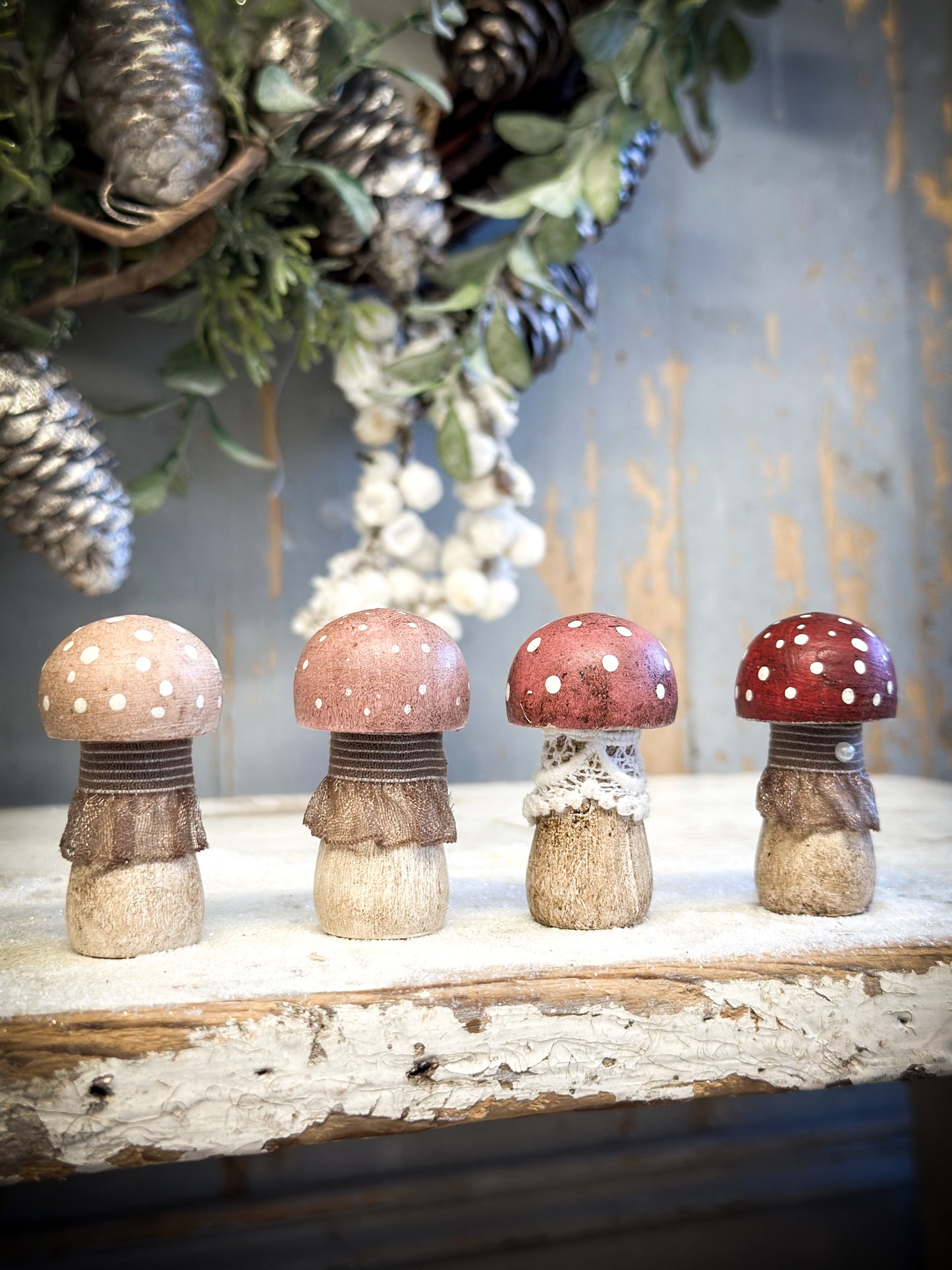 A wooden hand painted and trimmed Christmas village toadstool medium button one
