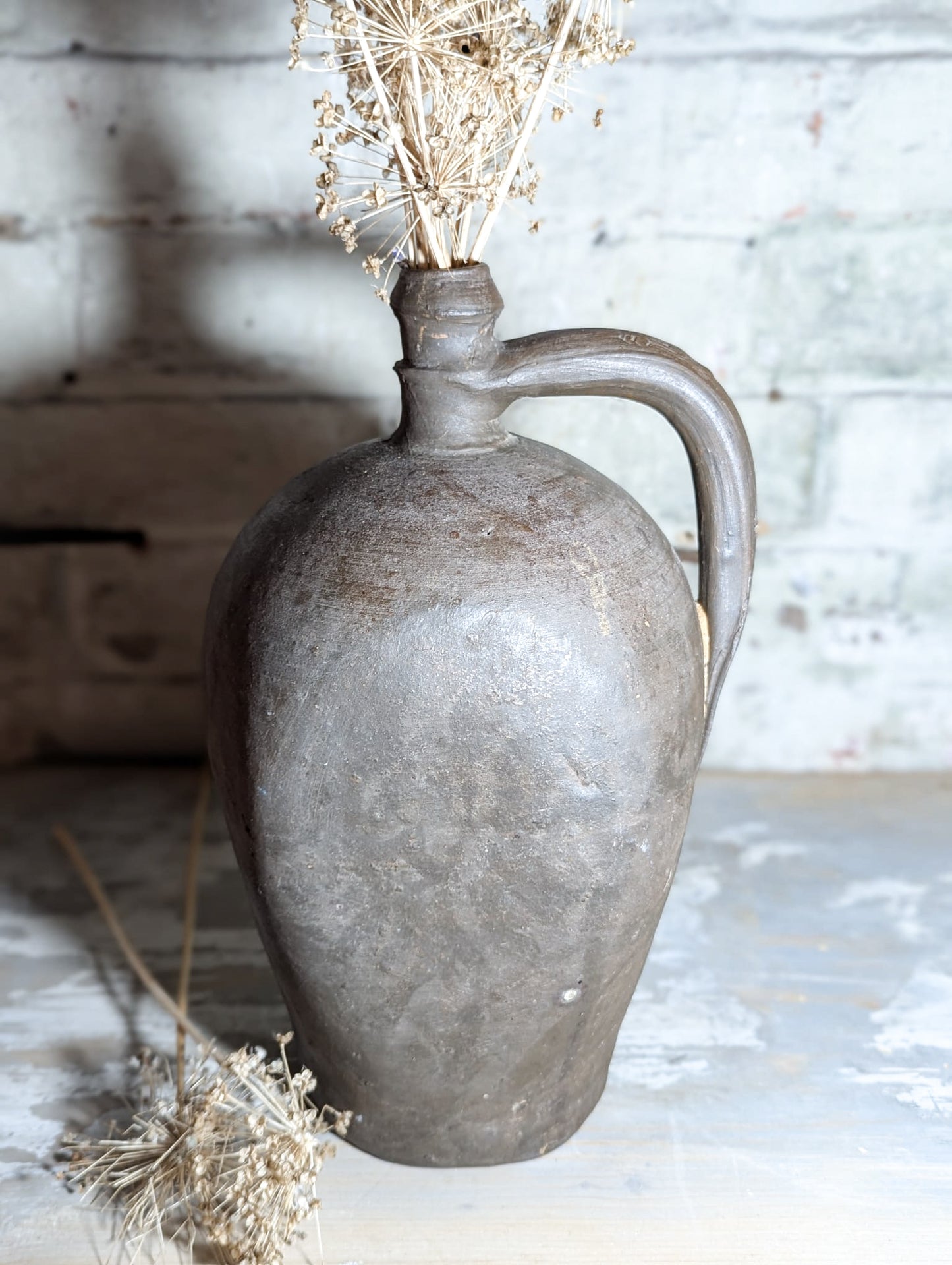 A stunning large Primitive French Antique Black Pottery oil bottle