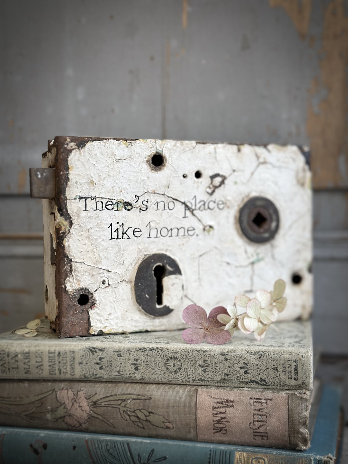 An Antique Lock With Hand Painted Quote