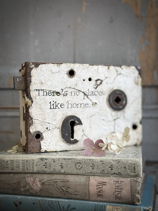 An Antique Lock With Hand Painted Quote