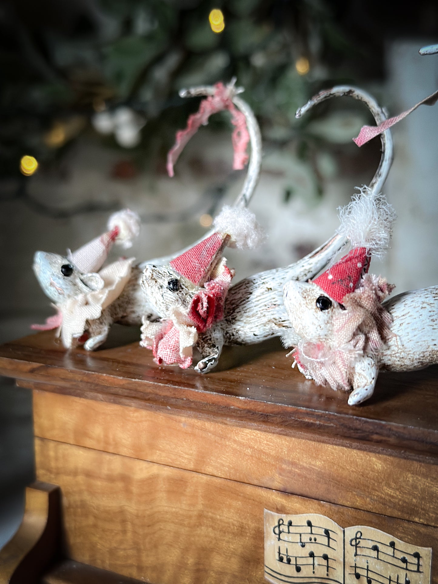 A cold painted brass “night before Christmas mouse” with a fabric ruffle and Christmas hat