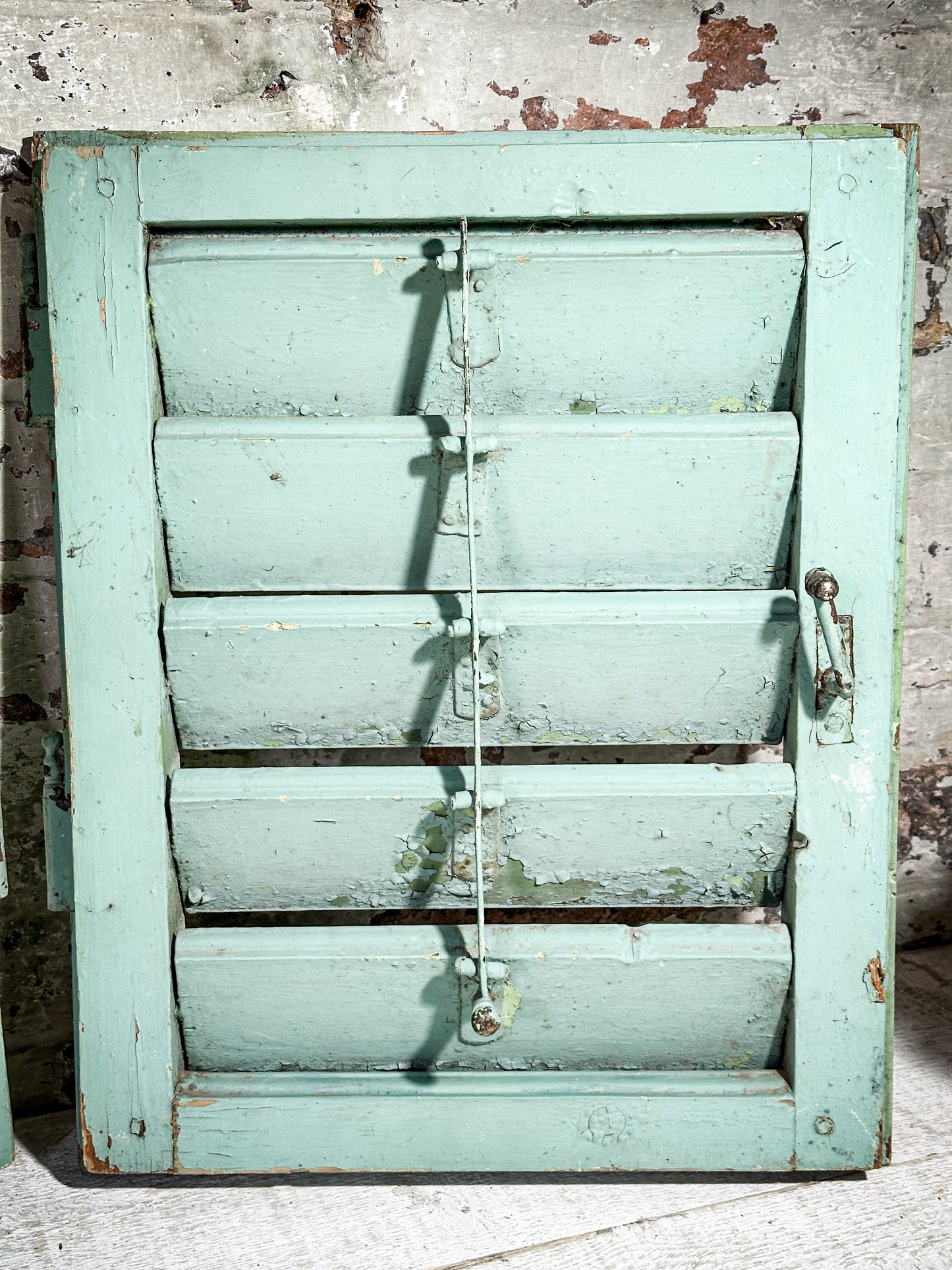 A Pair of French Green Chippy Painted Shutters