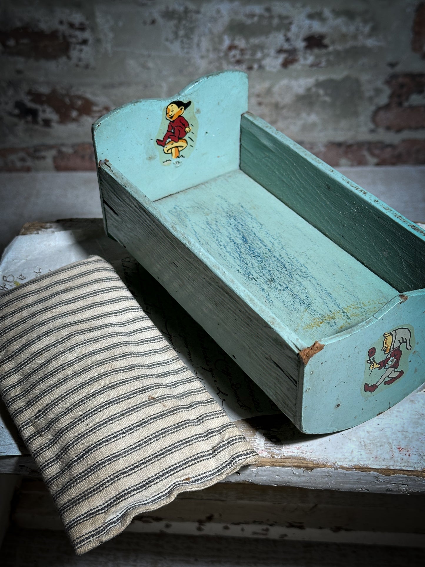 Vintage doll cradle with French ticking mattress