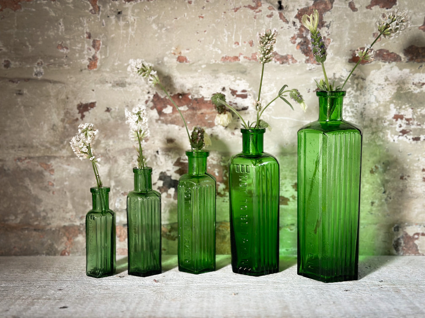 A set of Five lovely antique green poison bottles