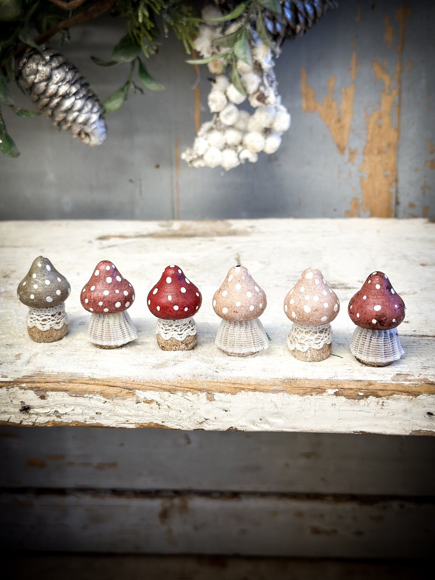 A wooden hand painted and trimmed Christmas village toadstool small pointy one