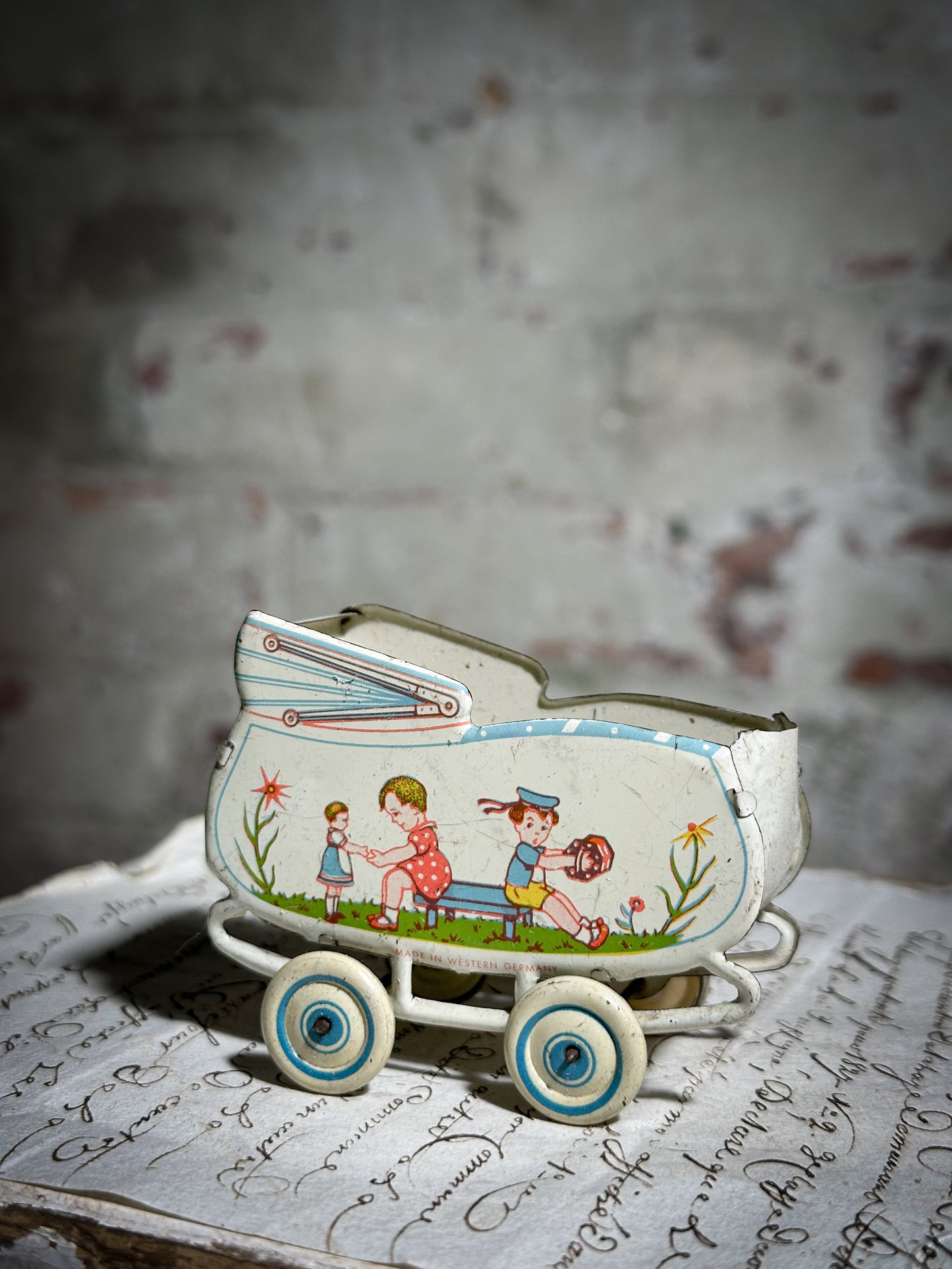 Vintage German tinplate doll’s house pram