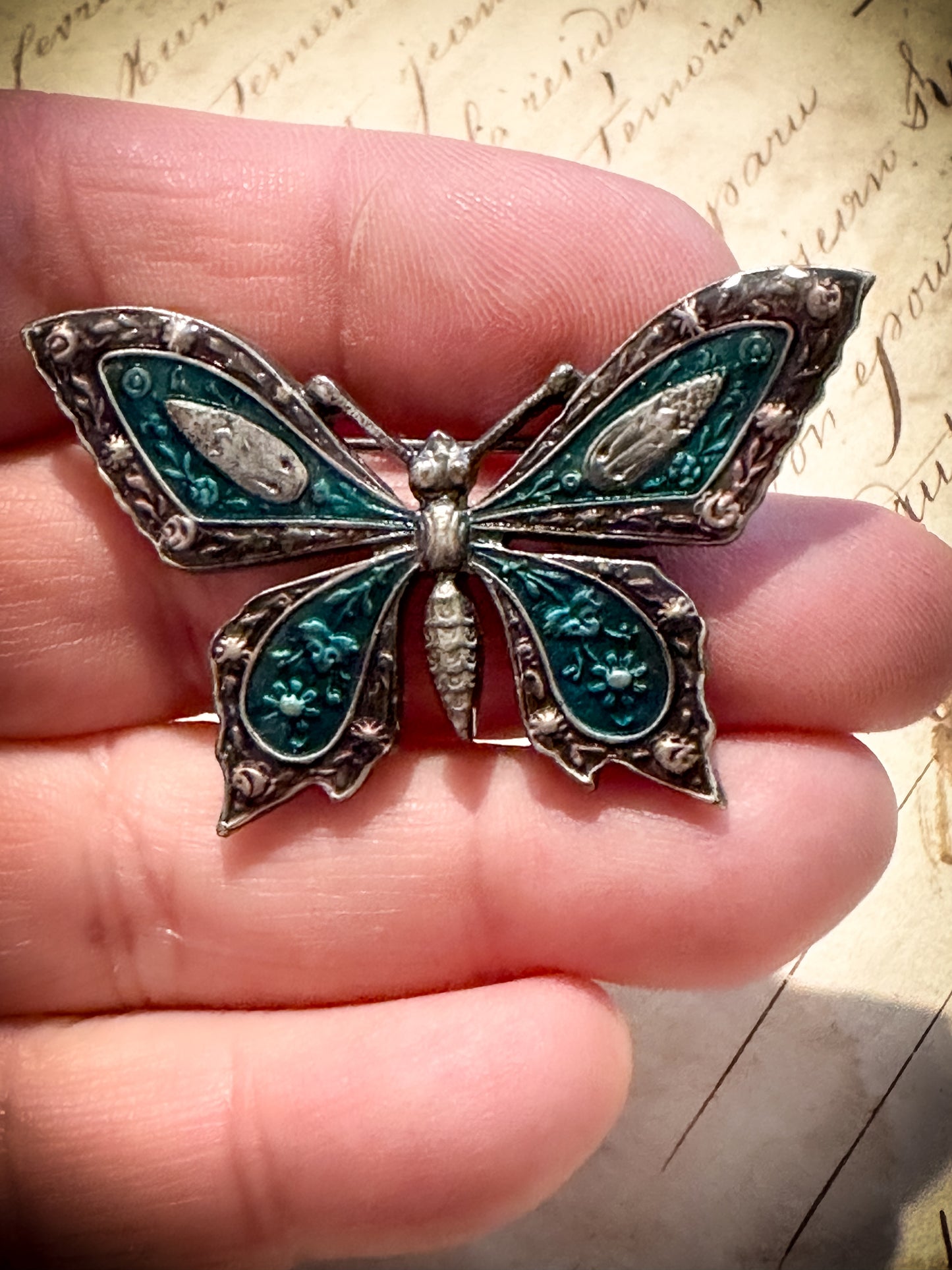 A pretty vintage enamel butterfly brooch