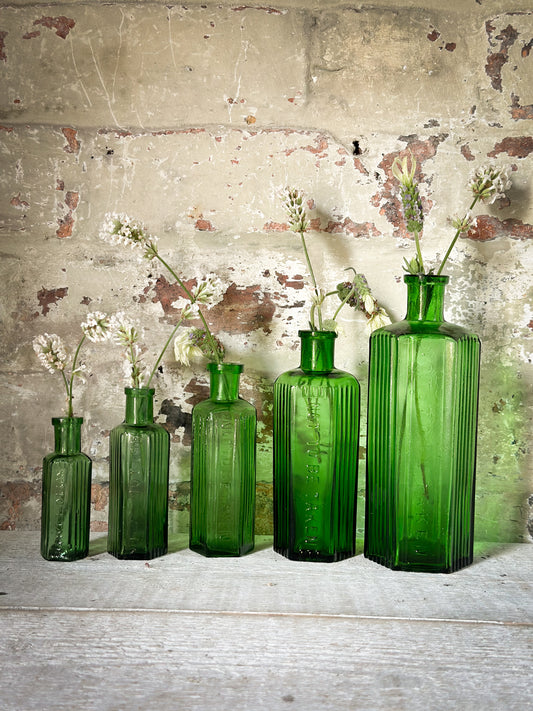 A set of Five lovely antique green poison bottles